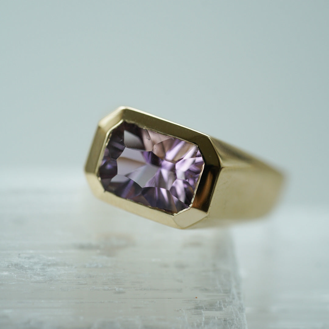modern ring in gold set with an octagon ametrine