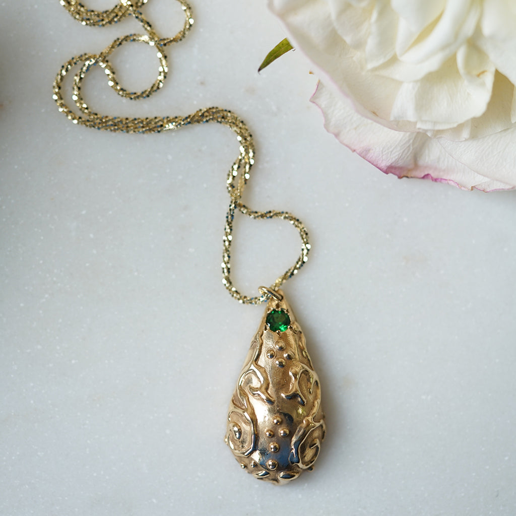 Pear Shape gold romanesque necklace with tsavorite