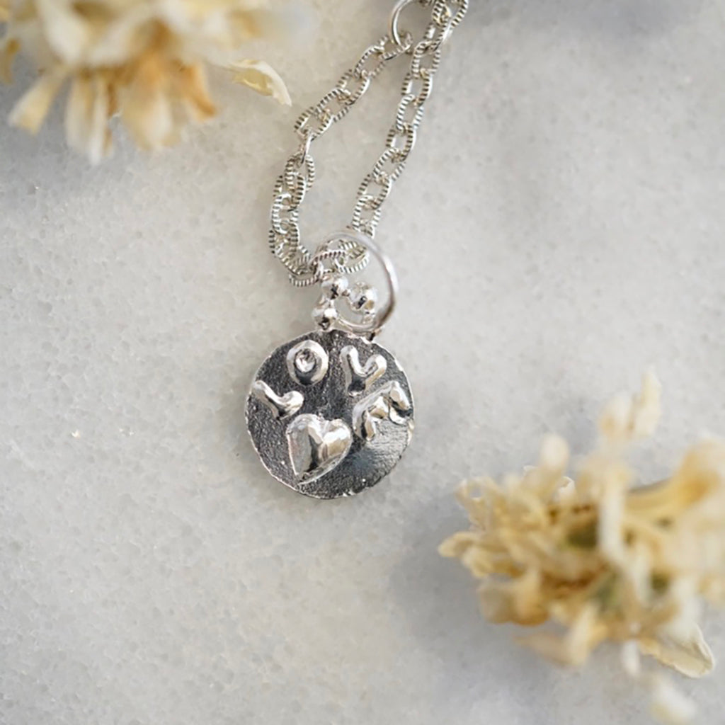 Love medallion necklace in silver