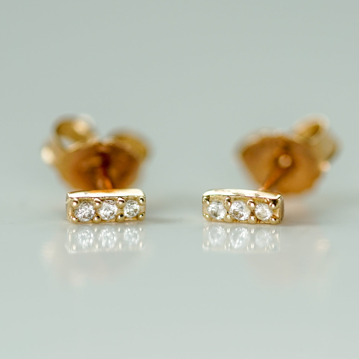 3 diamond gold earrings