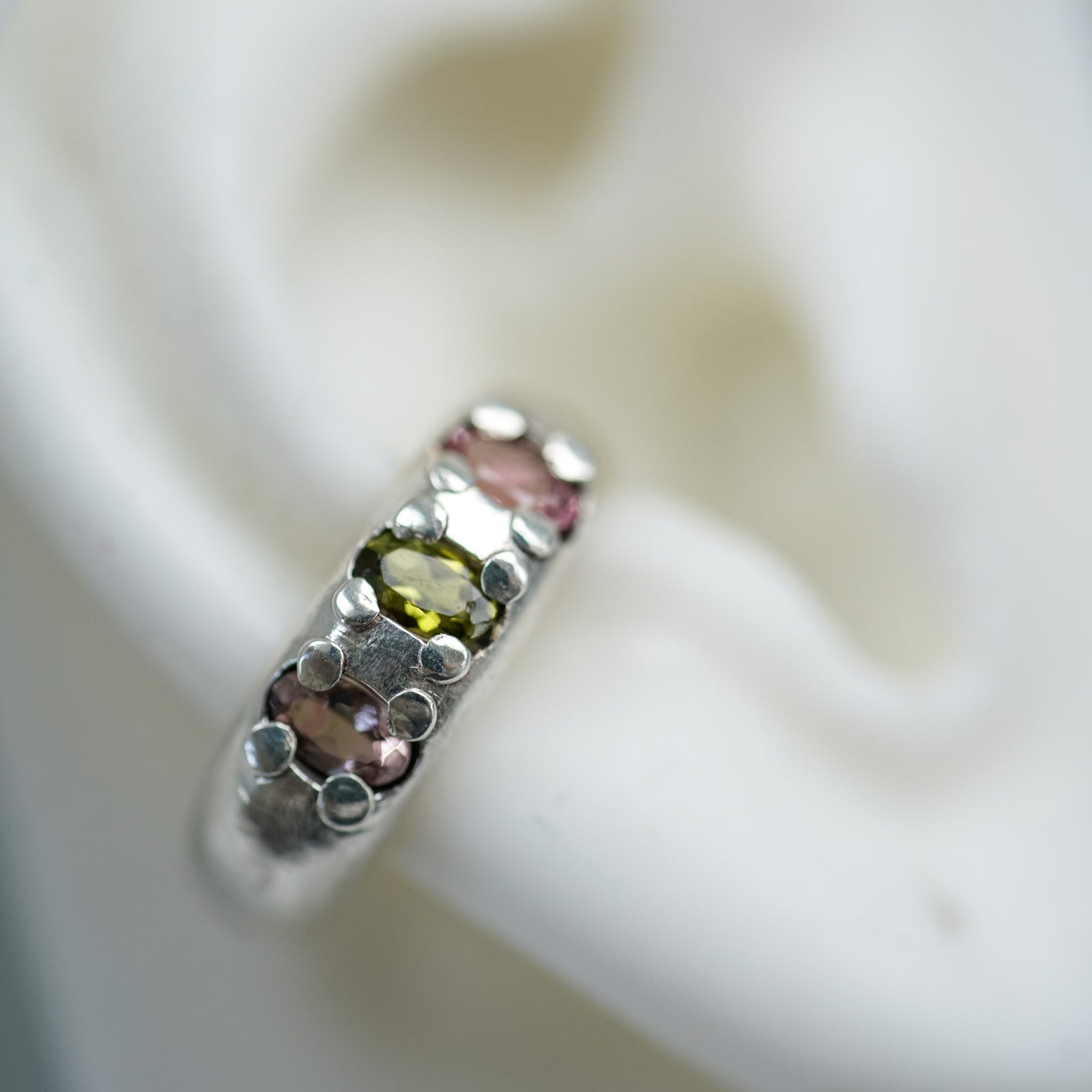 acfj multicolor tourmaline silver ear cuff on a ear lobe