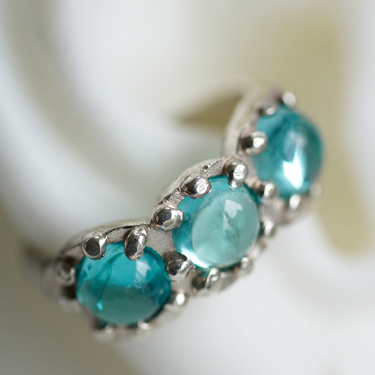acfj silver ear cuff with blue topaz cabochons