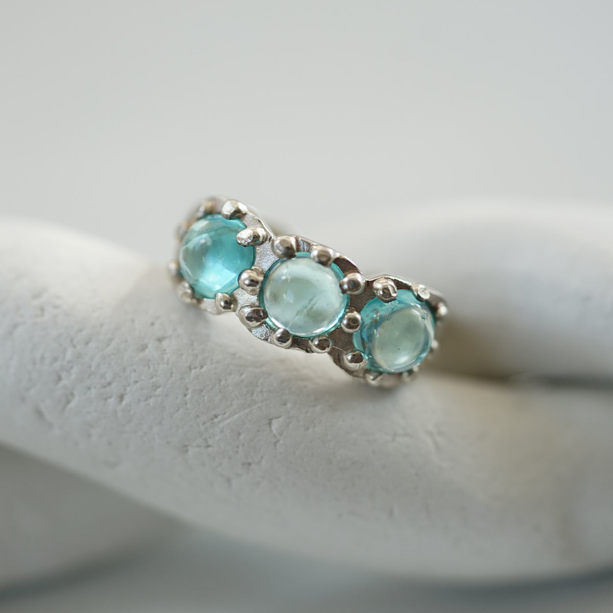 acfj silver ear cuff with blue topaz cabochons