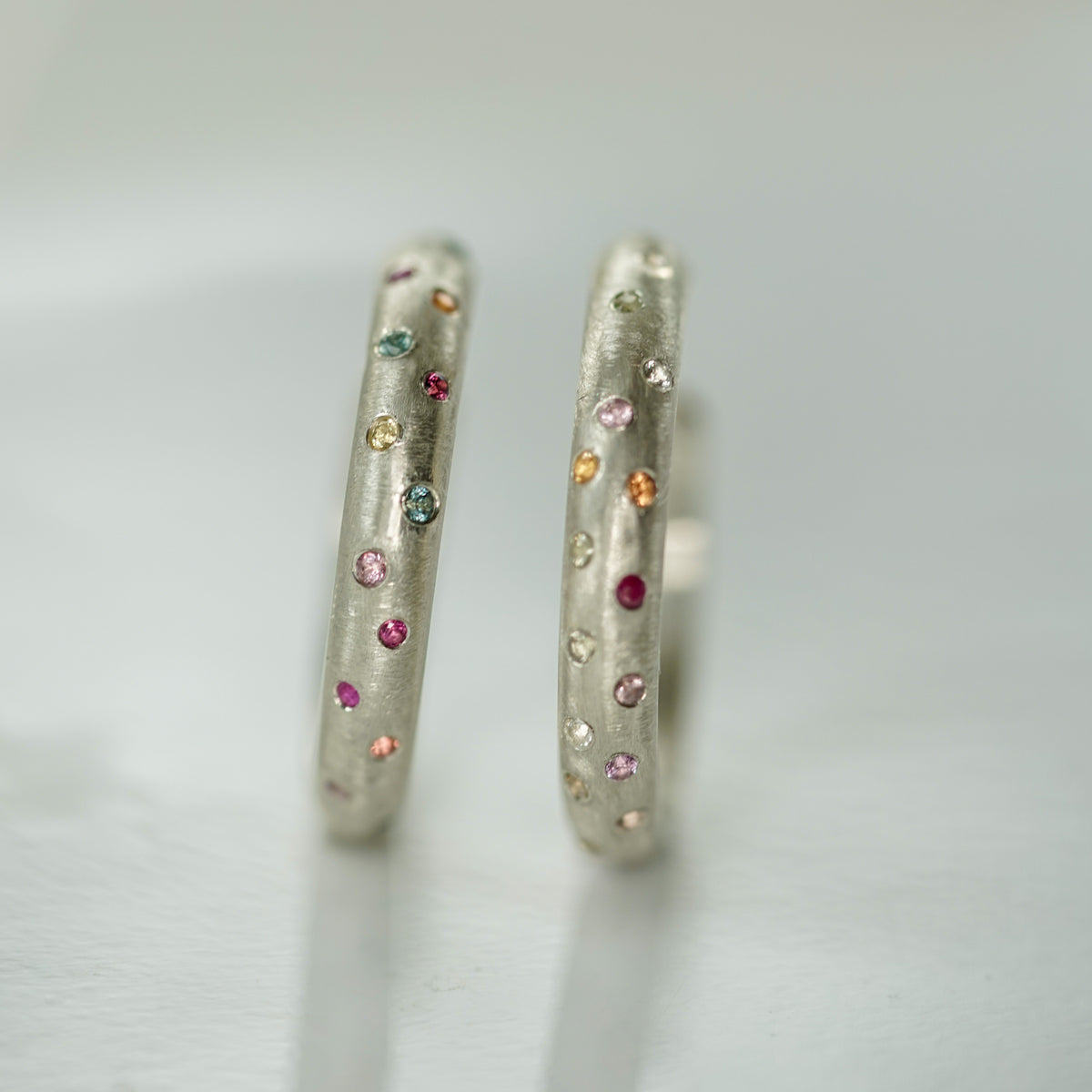 Hoop earrings with small multicolor sapphires