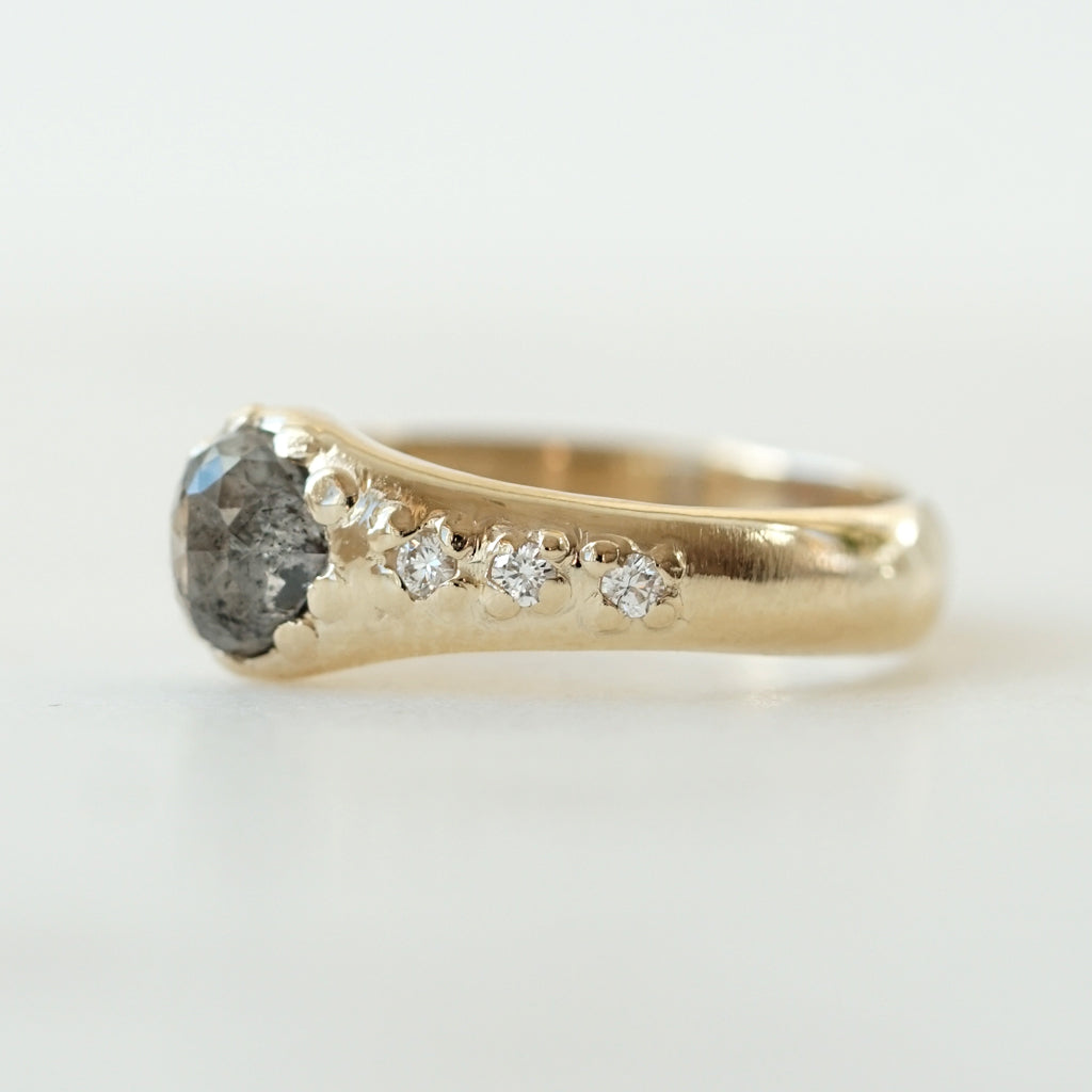 Heart shaped salt and pepper diamond with white diamonds on the side