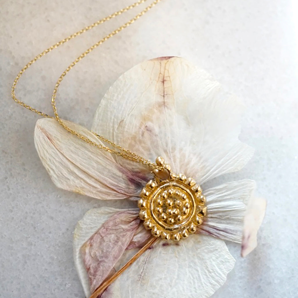 Large dots gold medallion