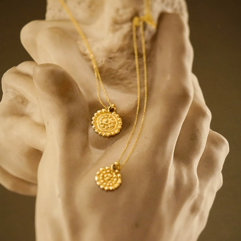 Small dots gold medallion