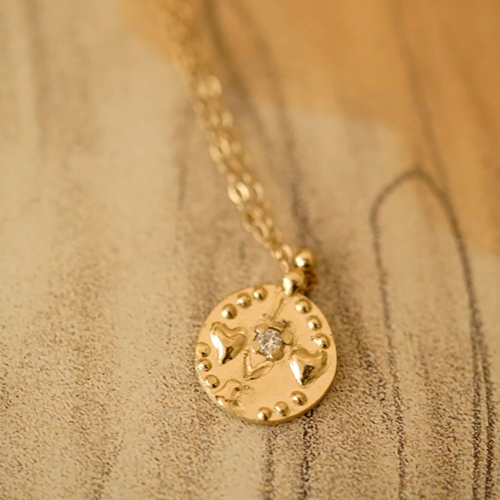 Love medallion necklace in gold with diamond