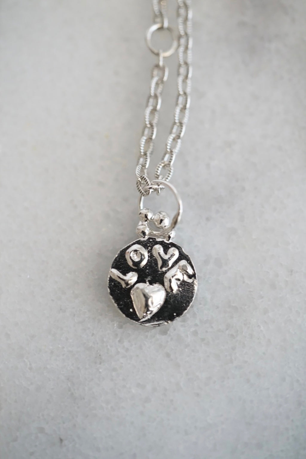 Love medallion necklace in silver