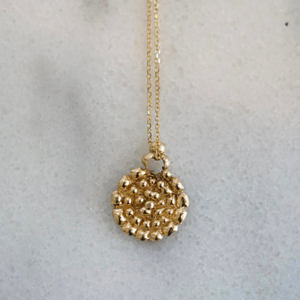 Small dots gold medallion